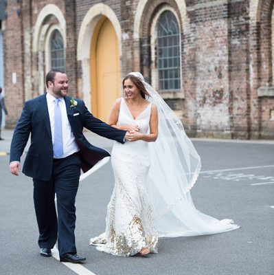 Bride and Groom walking down road